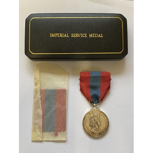 977 - AN IMPERIAL SERVICE MEDAL. A Queen Elizabeth II Imperial Service medal named to Wilfred Stanley Henb... 