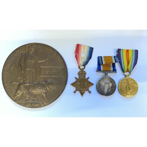 986 - A FIRST WORLD WAR TRIO AND MEMORIAL PLAQUE TO A CASUALTY AT JUTLAND. A trio comprising 1914-15 Star ... 