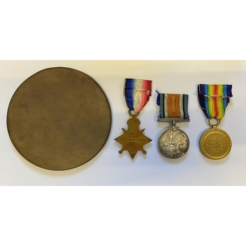 986 - A FIRST WORLD WAR TRIO AND MEMORIAL PLAQUE TO A CASUALTY AT JUTLAND. A trio comprising 1914-15 Star ... 