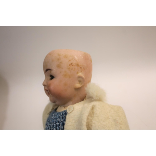 1421 - KAMMER & REINHARDT FOR SIMON & HALBIG a small baby doll with weighted brown eyes, open mouth and com... 