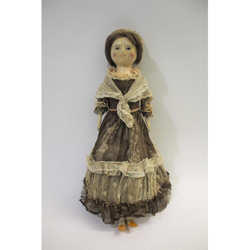 1425 - RARE 18THC ENGLISH WOODEN DOLL an English carved wooden doll with fixed eyes and stitched lashes, or... 