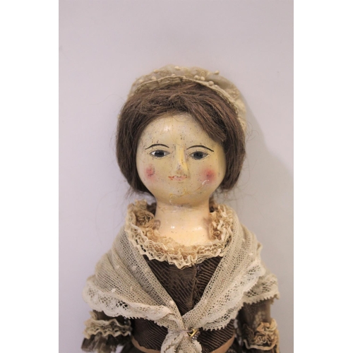 1425 - RARE 18THC ENGLISH WOODEN DOLL an English carved wooden doll with fixed eyes and stitched lashes, or... 