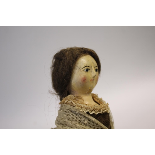 1425 - RARE 18THC ENGLISH WOODEN DOLL an English carved wooden doll with fixed eyes and stitched lashes, or... 