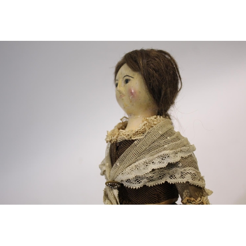 1425 - RARE 18THC ENGLISH WOODEN DOLL an English carved wooden doll with fixed eyes and stitched lashes, or... 