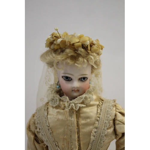 1428 - RARE JUMEAU PARISIENNE FASHION DOLL circa 1870, with a pale bisque swivel head on shoulder plate, an... 