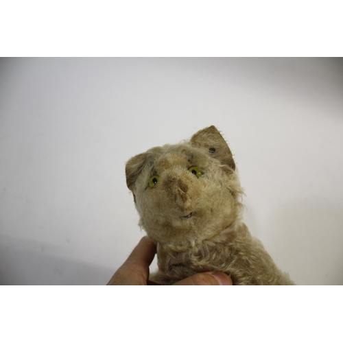 1432 - VINTAGE STEIFF CAT a soft toy cat with swivel limbs, glass eyes and stitched mouth. With a metal Ste... 