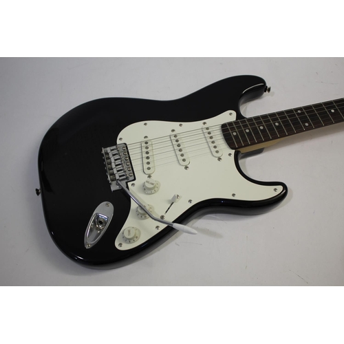 1441 - FENDER STRATOCASTER SQUIER GUITAR - KOREA with a black and white finish and three control dials, and... 