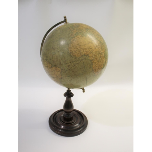 1452 - BACON'S EXCELSIOR TERRESTRIAL GLOBE a 12 inch terrestrial table globe mounted on a turned wooden sta... 