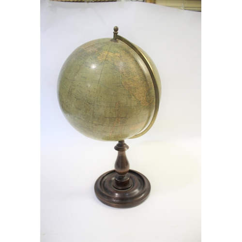 1452 - BACON'S EXCELSIOR TERRESTRIAL GLOBE a 12 inch terrestrial table globe mounted on a turned wooden sta... 