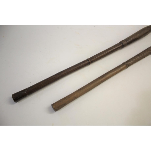 1473 - TRIBAL WAR CLUB of pointed form, the shaft with cross hatch carving, 81cms long. Also with another t... 