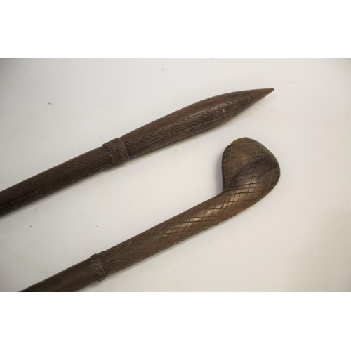 1473 - TRIBAL WAR CLUB of pointed form, the shaft with cross hatch carving, 81cms long. Also with another t... 