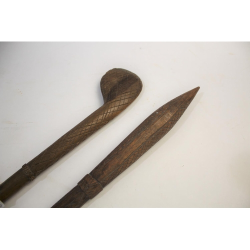 1473 - TRIBAL WAR CLUB of pointed form, the shaft with cross hatch carving, 81cms long. Also with another t... 