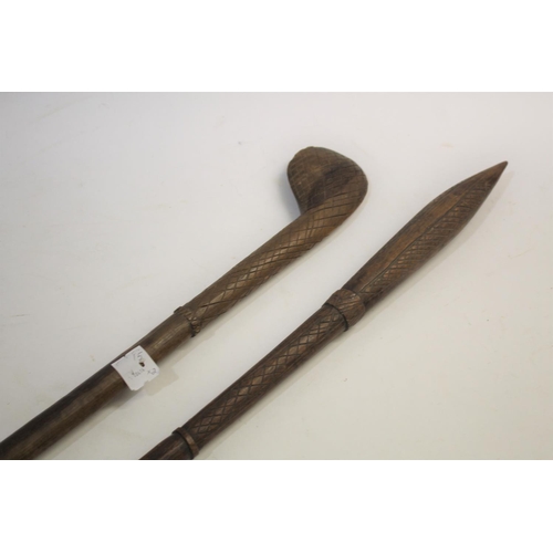 1473 - TRIBAL WAR CLUB of pointed form, the shaft with cross hatch carving, 81cms long. Also with another t... 