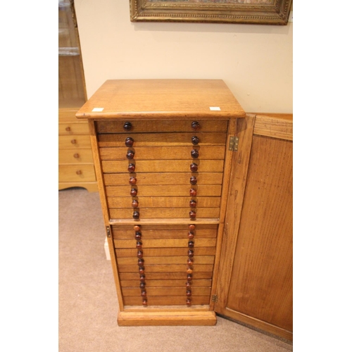 1485 - OAK COLLECTORS CABINET a late 19thc or early 20thc cabinet, with 18 internal drawers (each drawer wi... 