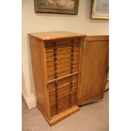 1485 - OAK COLLECTORS CABINET a late 19thc or early 20thc cabinet, with 18 internal drawers (each drawer wi... 