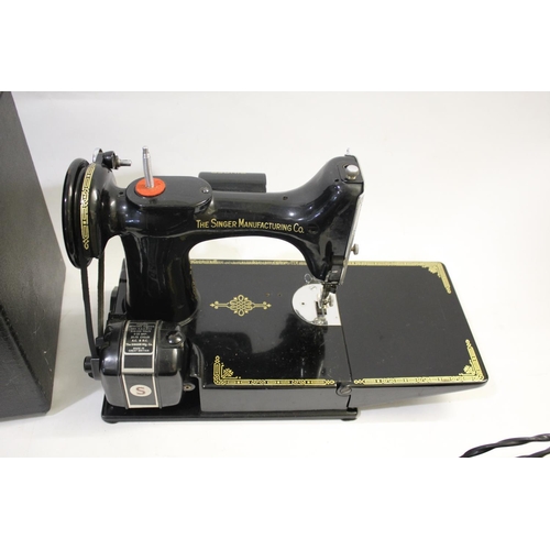 1493 - CASED PORTABLE SINGER SEWING MACHINE - 221K a portable folding featherweight sewing machine No 221K1... 