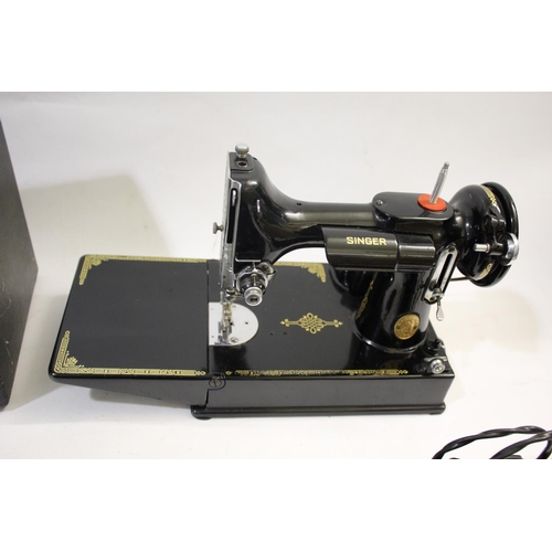 1493 - CASED PORTABLE SINGER SEWING MACHINE - 221K a portable folding featherweight sewing machine No 221K1... 