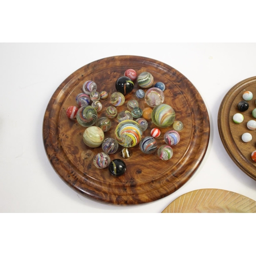 1504 - SOLITAIRE BOARDS & MARBLES including a burr wood board with various hand blown and machine made marb... 