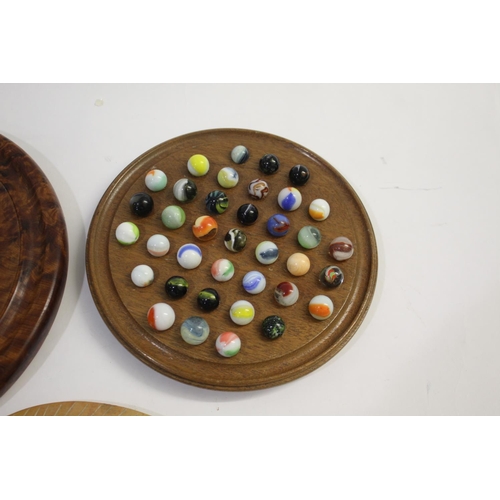 1504 - SOLITAIRE BOARDS & MARBLES including a burr wood board with various hand blown and machine made marb... 