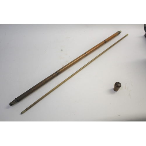 1509 - BARREL MEASURING WALKING STICK a bamboo walking stick with a concealed wooden and brass topped barre... 