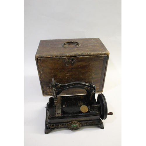 1520 - NEW AMERICAN CAST IRON SEWING MACHINE - CASED a late 19thc New American cast iron sewing machine, wi... 