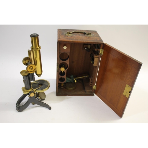 1527 - SWIFT & SON CASED MICROSCOPE a brass and metal monocular microscope, marked for Swift & Son, London,... 