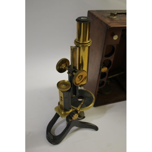 1527 - SWIFT & SON CASED MICROSCOPE a brass and metal monocular microscope, marked for Swift & Son, London,... 