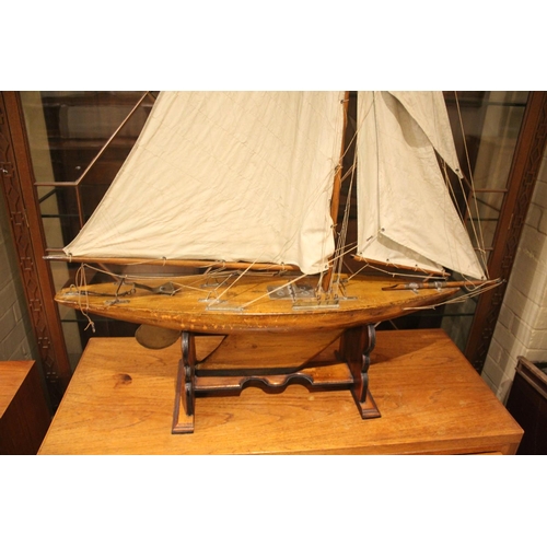 1536 - ANTIQUE POND YACHT a well made wooden hulled pond yacht mounted with metal fixings, complete with ma... 