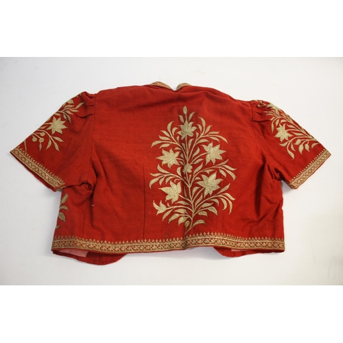 1645 - VINTAGE TURKISH JACKET an early 20thc red wool short sleeved cropped Turkish jacket, with embroidere... 