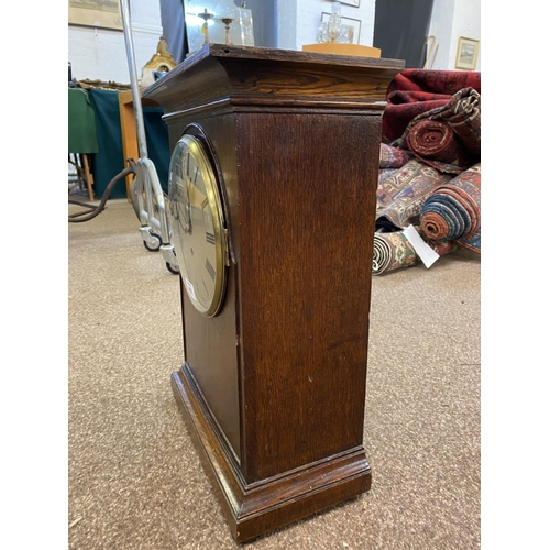 802 - A LARGE R.A.F. MANTEL CLOCK. A large oak cased mantel clock with 20cm domed and silvered dial with R... 