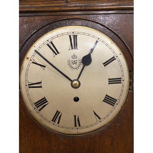 802 - A LARGE R.A.F. MANTEL CLOCK. A large oak cased mantel clock with 20cm domed and silvered dial with R... 