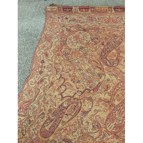 1612 - PAISLEY SHAWL a large paisley shawl with typical colours and motifs including boteh, with a fringe a... 