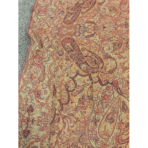 1612 - PAISLEY SHAWL a large paisley shawl with typical colours and motifs including boteh, with a fringe a... 