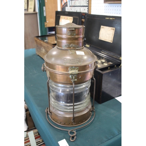 1483 - LARGE COPPER SHIPS LANTERN - THE MARITIME the copper lantern with a glass centre and metal handle, m... 