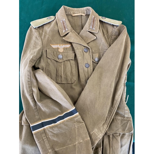 679 - A GERMAN SECOND WORLD WAR OR LATER AFRICA KORPS JACKET.
A pale green German enlisted man's jacket wi... 