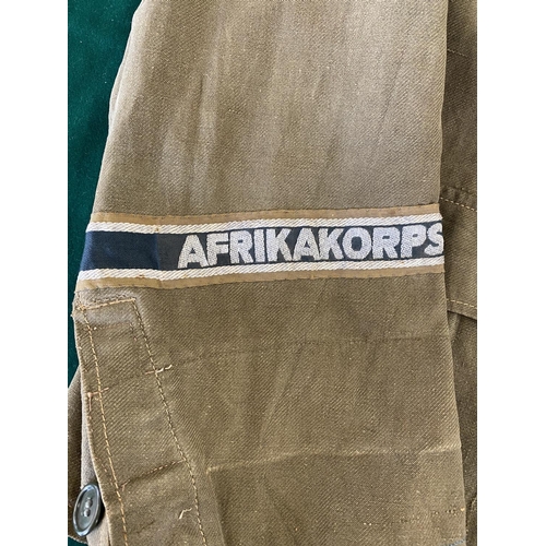 679 - A GERMAN SECOND WORLD WAR OR LATER AFRICA KORPS JACKET.
A pale green German enlisted man's jacket wi... 