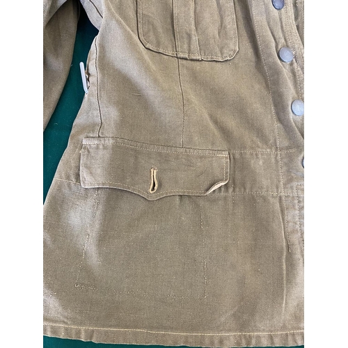 679 - A GERMAN SECOND WORLD WAR OR LATER AFRICA KORPS JACKET.
A pale green German enlisted man's jacket wi... 