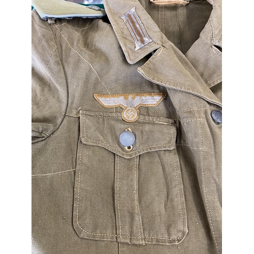 679 - A GERMAN SECOND WORLD WAR OR LATER AFRICA KORPS JACKET.
A pale green German enlisted man's jacket wi... 