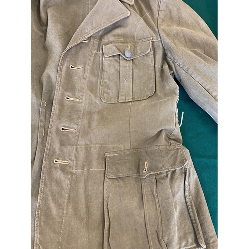 679 - A GERMAN SECOND WORLD WAR OR LATER AFRICA KORPS JACKET.
A pale green German enlisted man's jacket wi... 