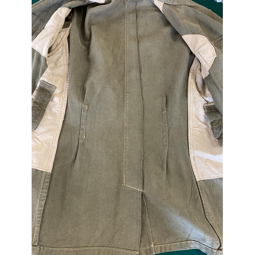 679 - A GERMAN SECOND WORLD WAR OR LATER AFRICA KORPS JACKET.
A pale green German enlisted man's jacket wi... 