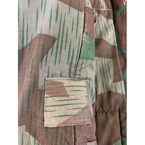 680 - A SECOND WORLD WAR OR LATER GERMAN SPLINTER CAMOUFLAGE JACKET. A heavily lined German 'splinter camo... 