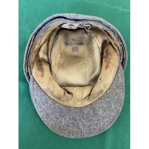 681a - A SECOND WORLD WAR OR LATER LUFTWAFFE FORAGE CAP.
A grey forage or ski cap with Luftwaffe eagle and ... 