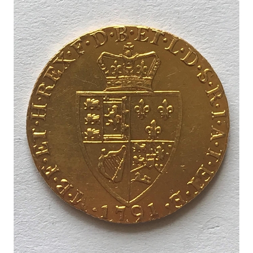 1268A - A GEORGE III  GOLD GUINEA. A George III Guinea, laureate bust r, reverse with spade shaped shield, d... 