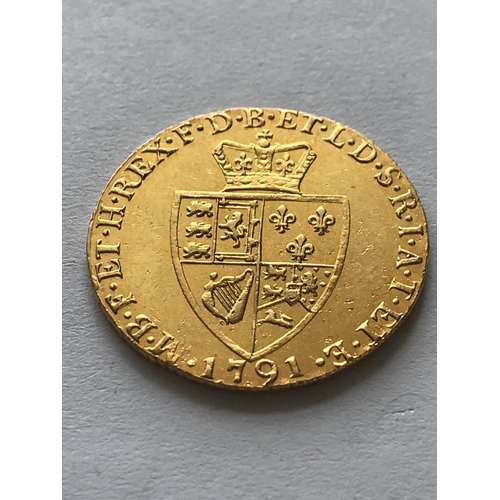 1268A - A GEORGE III  GOLD GUINEA. A George III Guinea, laureate bust r, reverse with spade shaped shield, d... 