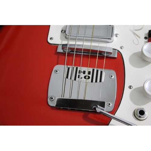 1448 - WATKINS RAPIER ELECTIC GUITAR a 1960's Watkins Rapier 33 electric guitar in a red and white finish, ... 