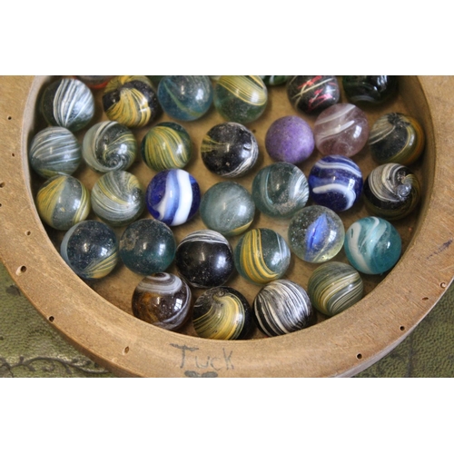 1489 - VINTAGE MARBLES & SOLITAIRE BOARD a solitaire board with a compartment underneath with a variety of ... 