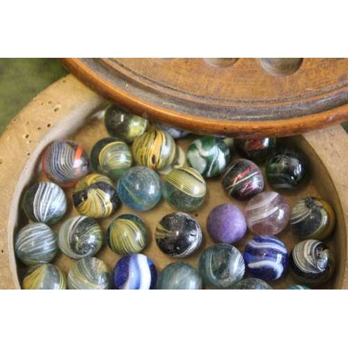 1489 - VINTAGE MARBLES & SOLITAIRE BOARD a solitaire board with a compartment underneath with a variety of ... 