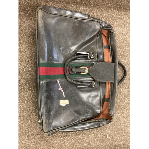 1613 - VINTAGE GUCCI LEATHER LUGGAGE purchased circa 1971, including a leather travelling bag with brass ca... 