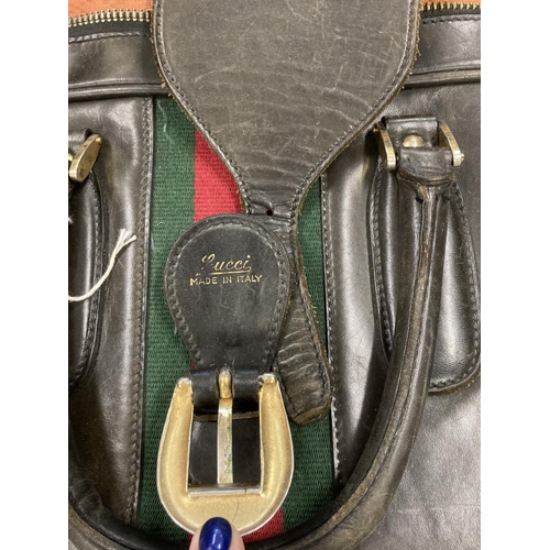 1613 - VINTAGE GUCCI LEATHER LUGGAGE purchased circa 1971, including a leather travelling bag with brass ca... 