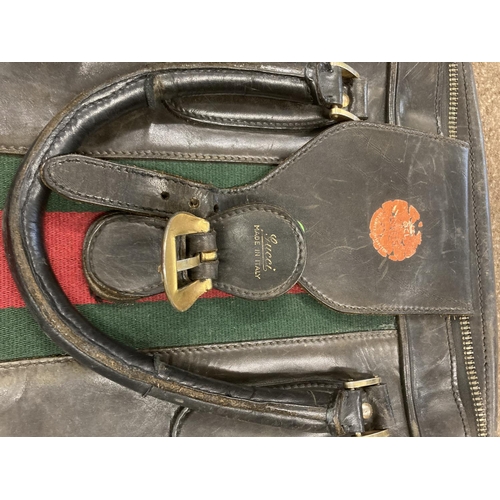 1613 - VINTAGE GUCCI LEATHER LUGGAGE purchased circa 1971, including a leather travelling bag with brass ca... 